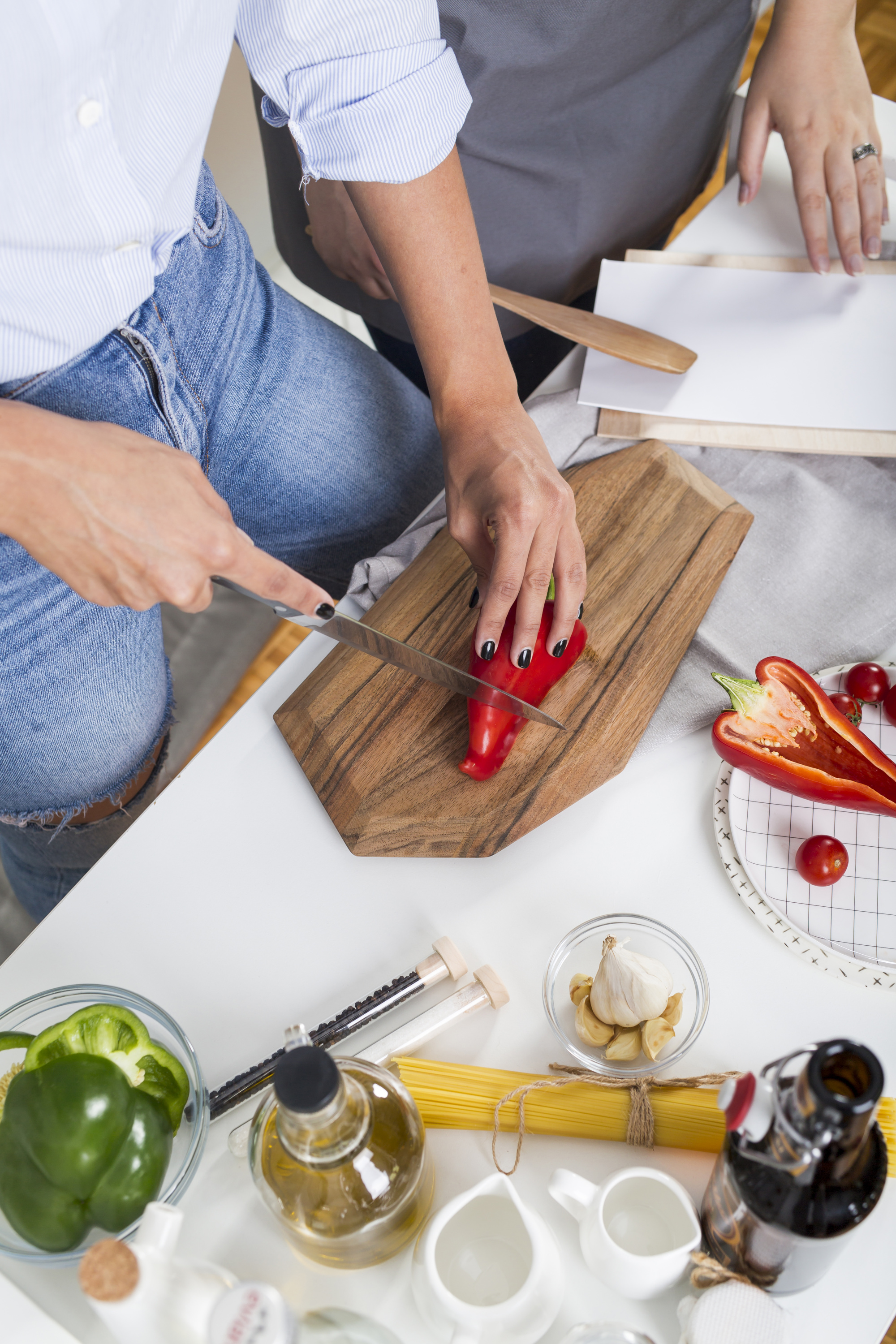 Small group cooking around a wooden table